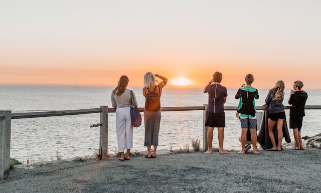 Inspiring moment of adventure-packed getaways with a traveler watching sunset