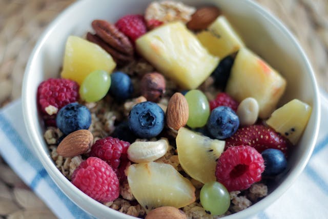 Fresh balanced plant-based snacks for mid-day energy arranged with fruits, nuts, and grains.