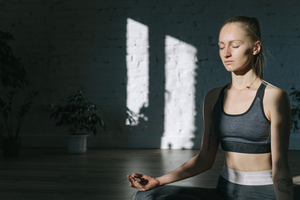 Person practicing breathing exercises for better sleep to improve mental wellness and relaxation