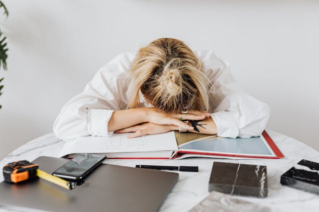 Tired person showing burnout due to sleep quality and emotional well-being issues 