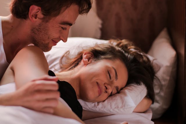 Happy couple at bedtime supporting sleep quality and emotional well being 