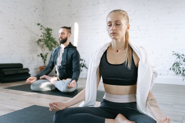 Person practicing deep breathing exercises for better sleep and mental wellness