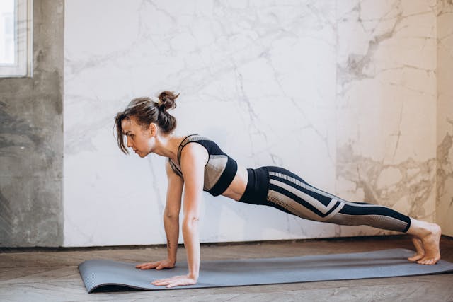 Person doing home HIIT workout plan with no equipment 