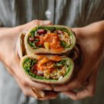 Veggie wrap with hummus – a savory option for balanced plant-based snacks for mid-day energy.