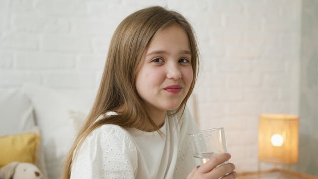 Glass of water with Lemon and herbs representing hydrogen and nutrition absorption -nutrient - dense diet 