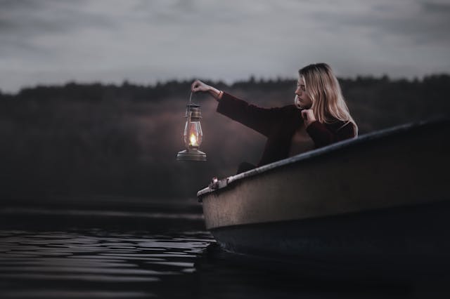 Person reflecting thoughts at night for sleep quality and emotional well-being 