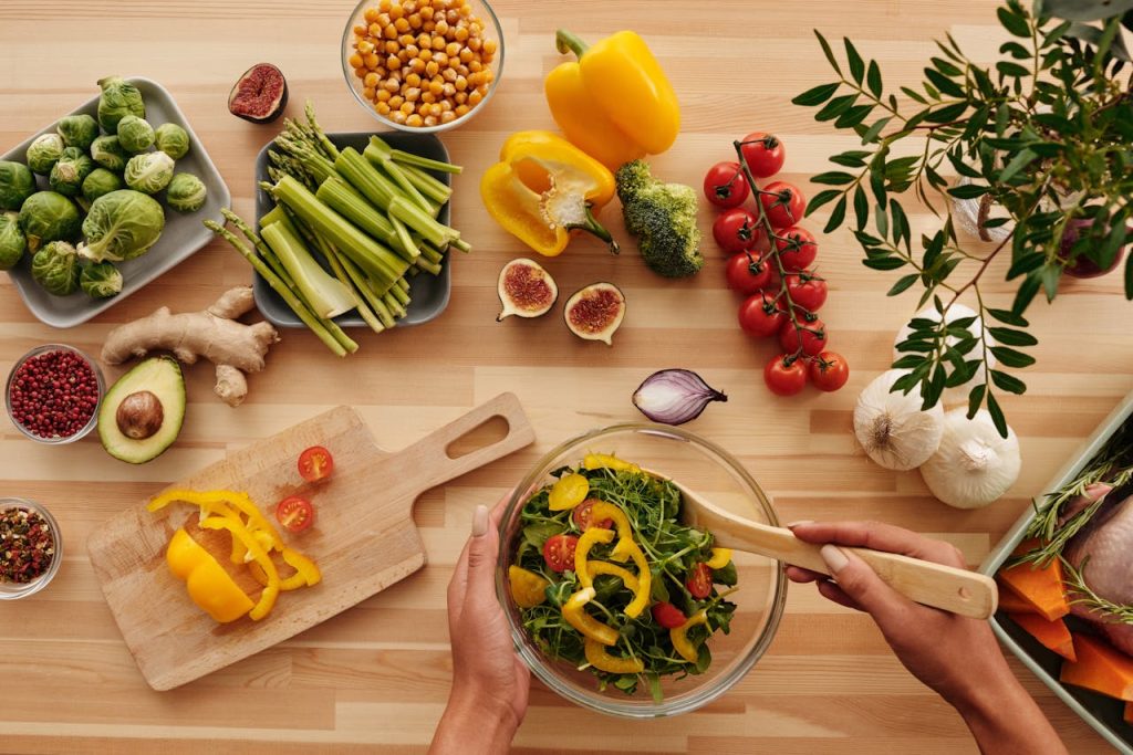 Colorful nutrient-dense diet foods on a healthy meal plate including vegetables, grains, and lean proteins