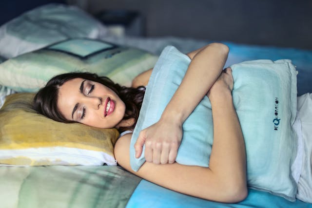Woman enjoying peaceful sleep at night promoting sleep quality and emotional well-being
