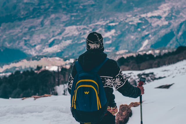 Hiker enjoying mountain view during Beaten-Path Adventure Trips