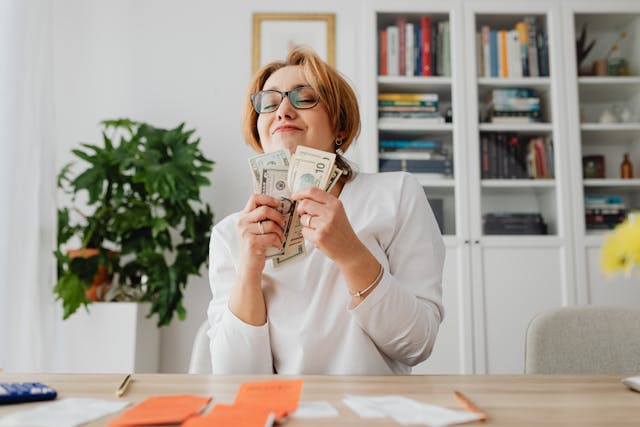 Happy person celebrating success representing boosted productivity and financial health