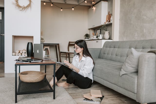 Focused individual using technology to implement daily productivity hacks and achieve goals