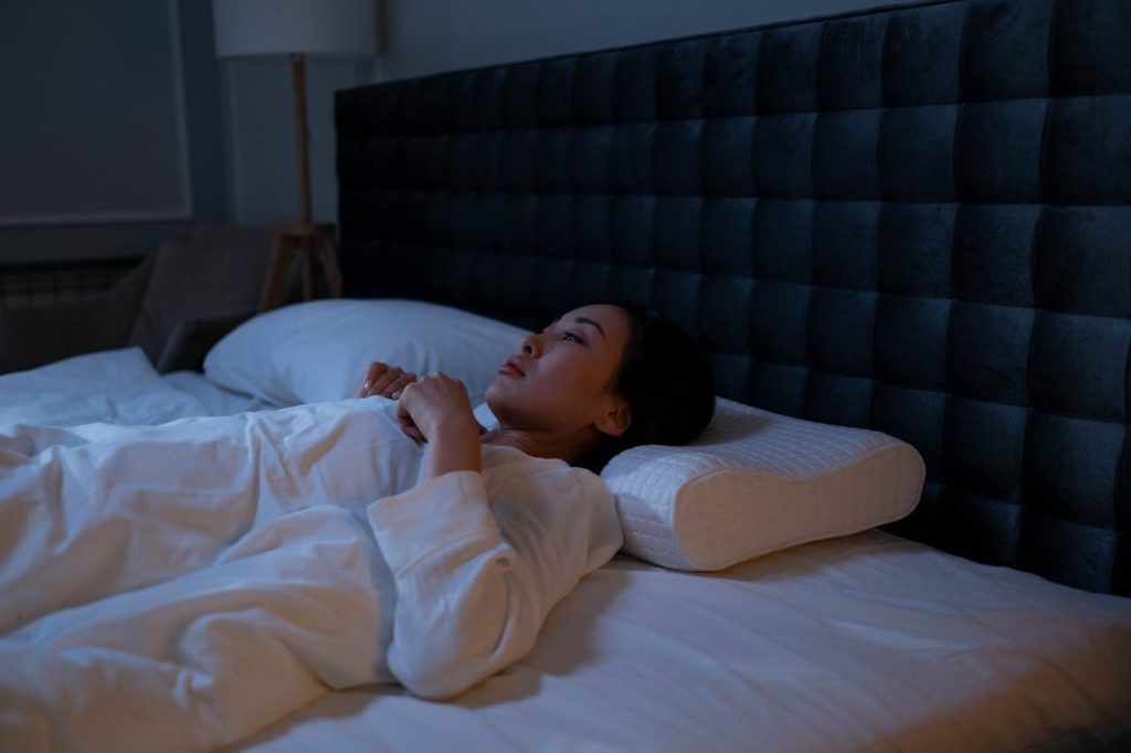 Peaceful woman experiencing deep sleep benefits for reducing stress and anxiety