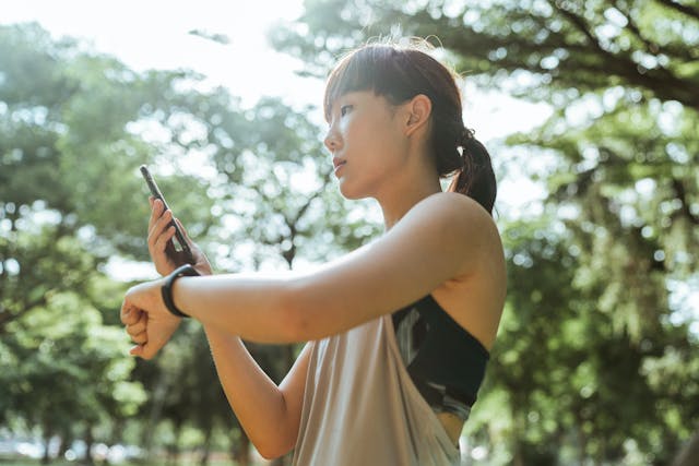 A calm person enjoying healthy lifestyle with a wearable fitness tracker