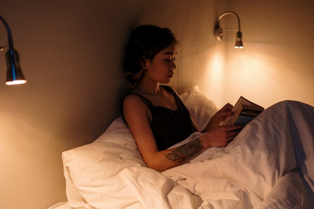 Person practicing bedtime routine for mental wellness and to improve sleep quality and reduce depression