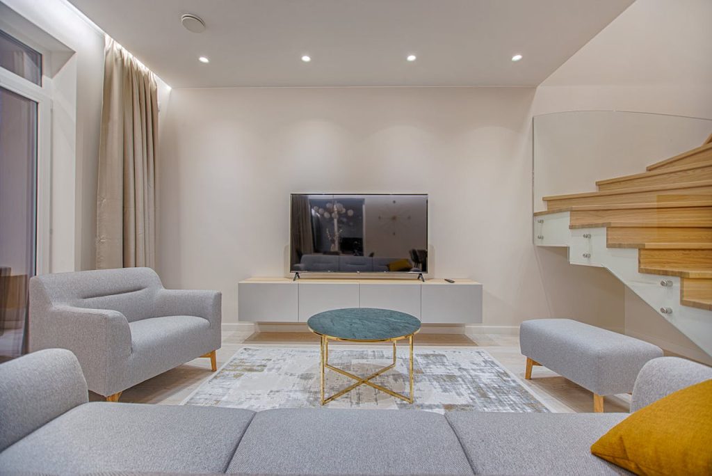 A clean and organized minimalist living room demonstrating effective minimalist home hacks for decluttering and simplicity.