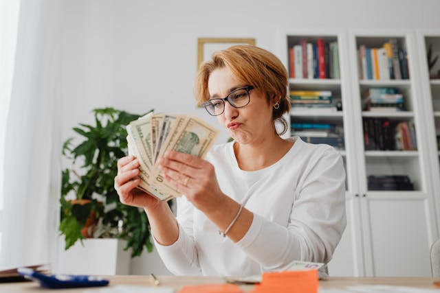 Successful money saving hacks and financial growth concept showing happy person