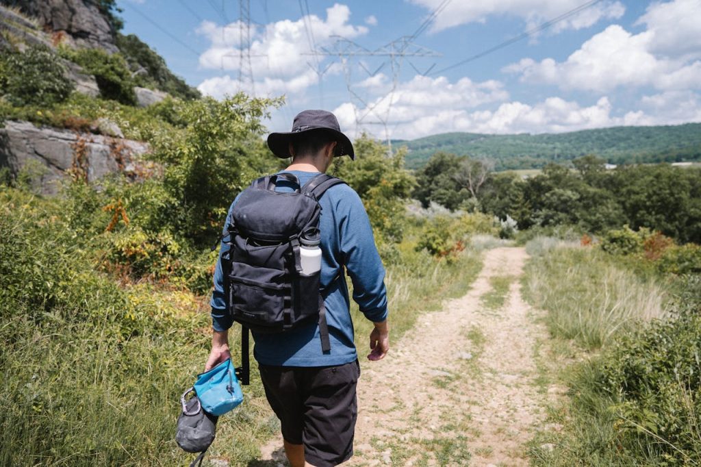 A happy solo traveler enjoying nature on a scenic adventure – solo travel ideas