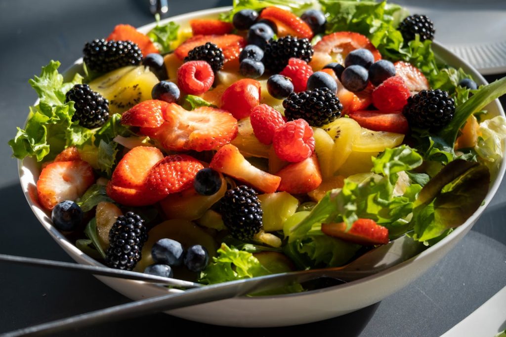 Colorful assortment of superfoods that boost immunity including fruits, vegetables, nuts, and seeds