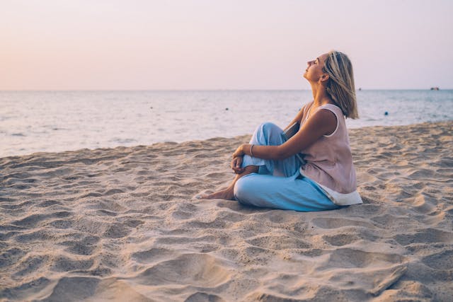 Sunrise at a top wellness beach destinations with peaceful yoga session