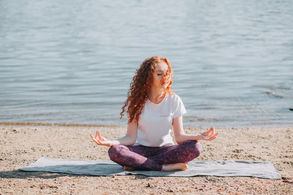 A serene wellness beach destination with sunset yoga session by the ocean