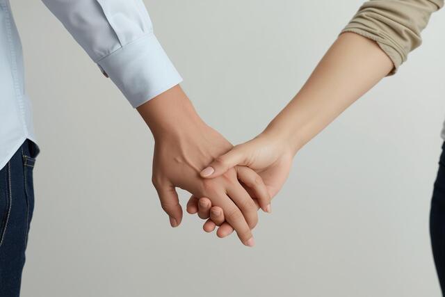 Couple holding hands to rebuild trust in a broken relationship and strengthen emotional bond
